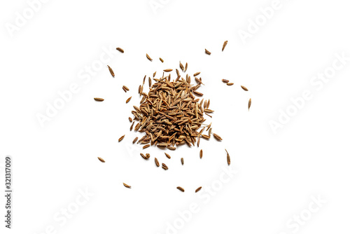 Top view of a pile of organic dry cumin seeds isolated on a white background photo