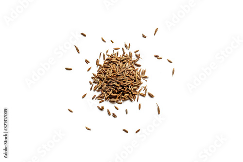 Top view of a pile of organic dry cumin seeds isolated on a white background