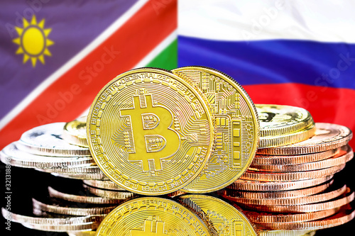 Bitcoins on Namibia and Russia flag background.