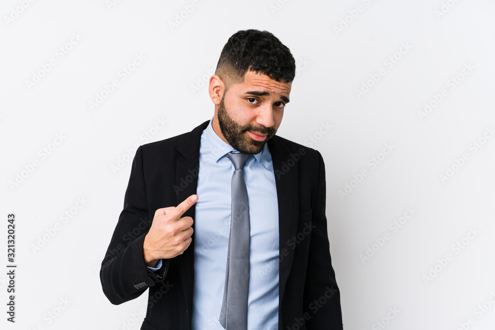 Young latin business woman against a white background isolated pointing with finger at you as if inviting come closer. Young latin business woman against a white background isolated pointing with finger at you as if inviting come closer.