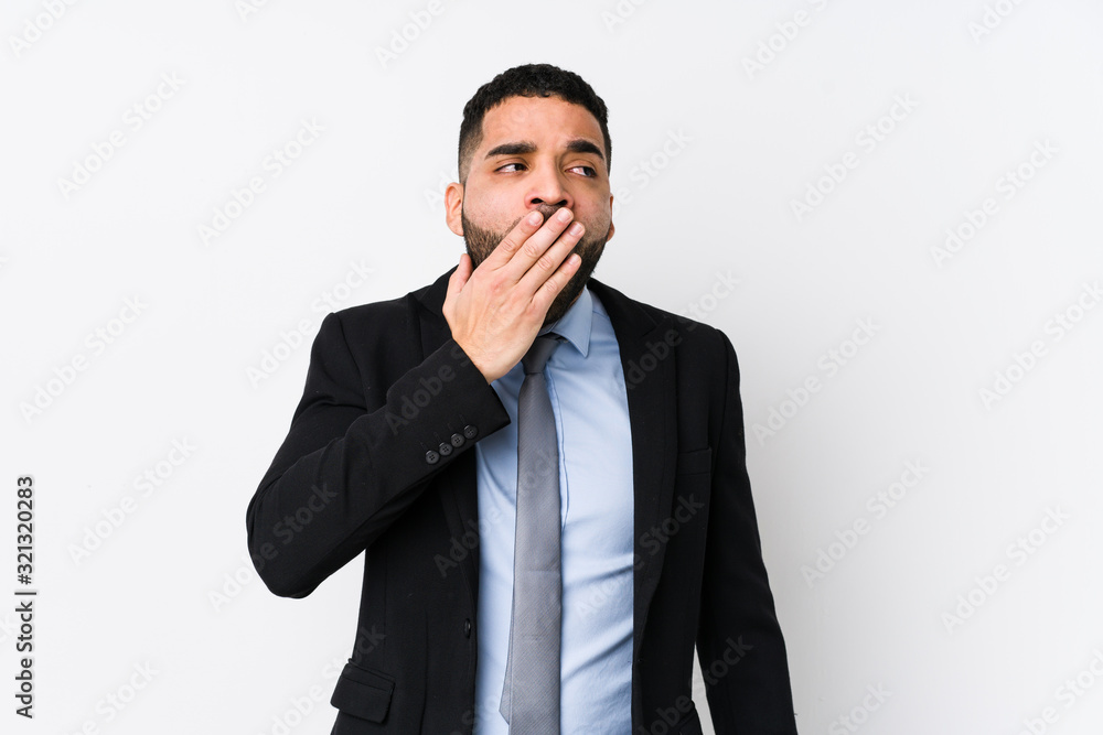 Young latin business woman against a white background isolated yawning showing a tired gesture covering mouth with hand. Young latin business woman against a white background isolated yawning showing a tired gesture covering mouth with hand.