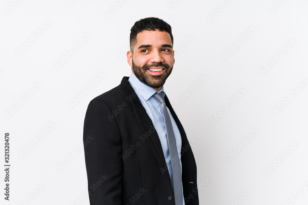 Young latin business woman against a white background isolated looks aside smiling, cheerful and pleasant. Young latin business woman against a white background isolated looks aside smiling, cheerful and pleasant.