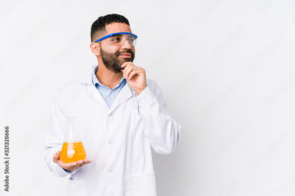 Young arabian chemical man isolated looking sideways with doubtful and skeptical expression. Young arabian chemical man isolated looking sideways with doubtful and skeptical expression.