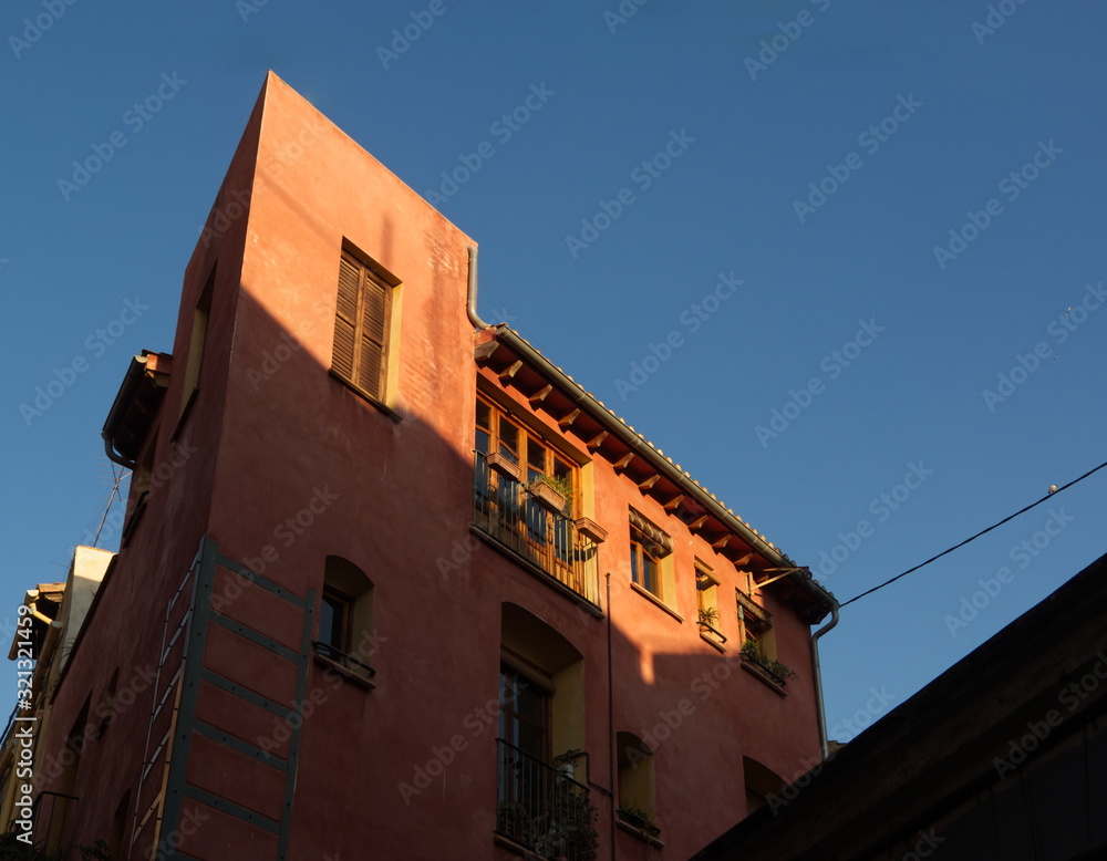 Colored traditional facade in Valencia with light and shadow