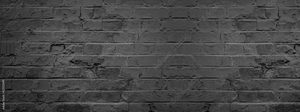 Fototapeta Dark black anthracite damaged rustic brick wall texture banner panorama