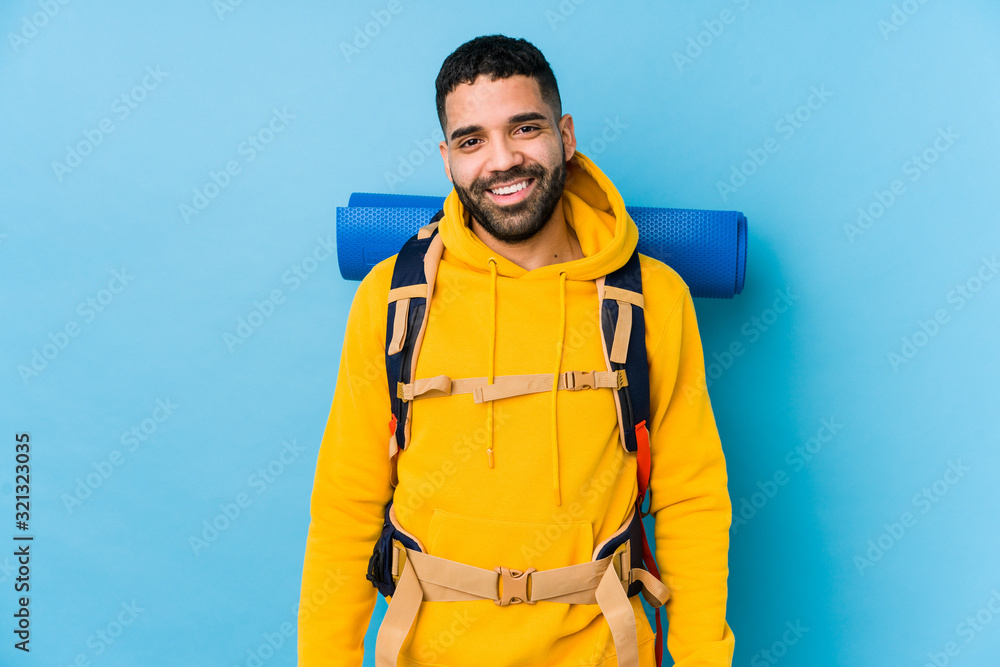 Young arabian traveler backpacker man isolated happy, smiling and cheerful. Young arabian traveler backpacker man isolated happy, smiling and cheerful.
