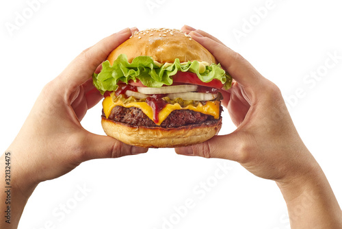 Hands holding hamburger on white