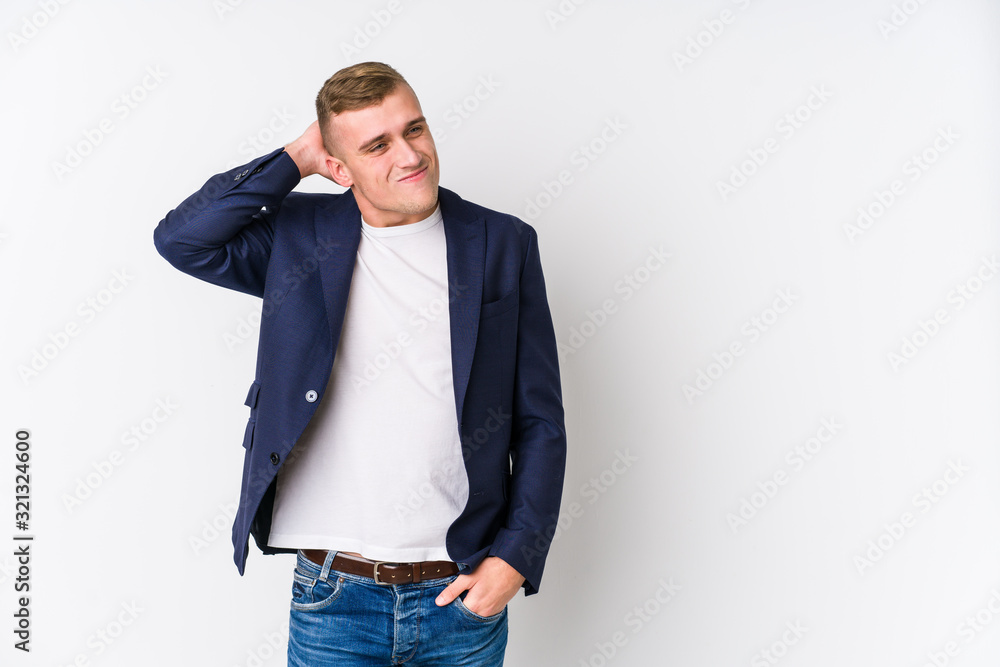 Young business caucasian man touching back of head, thinking and making a choice. Young business caucasian man touching back of head, thinking and making a choice.