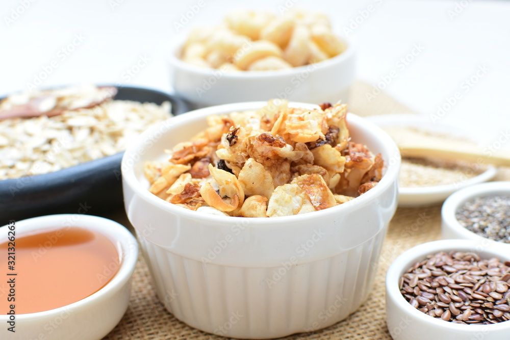 Granola mix accompanied by seeds and honey Granola mix accompanied by seeds and honey