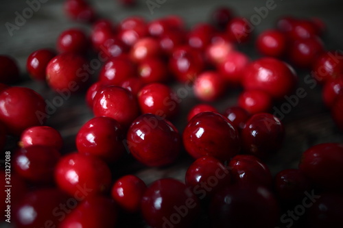 close up of cranberries on wooden background