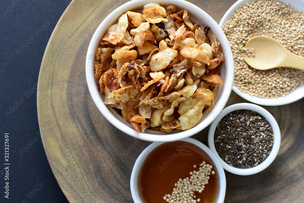 Granola mix accompanied by seeds and honey Granola mix accompanied by seeds and honey