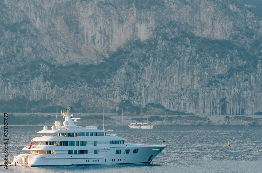 Sailing yachts and motor-boats off the Côte d'Azur coast in the saint raphael gulf, South of France, Europe Sailing yachts and motor-boats off the Côte d'Azur coast in the saint raphael gulf, South of France, Europe