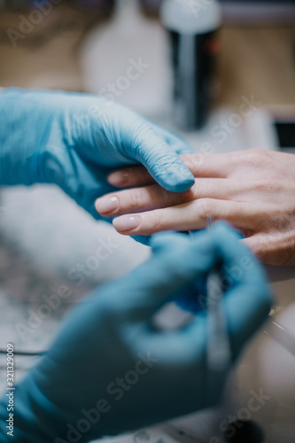 closeup of a woman making manicure