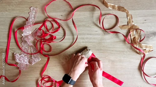 Gift wrapping top view. Gift for Valentine's Day. Ribbon for packaging