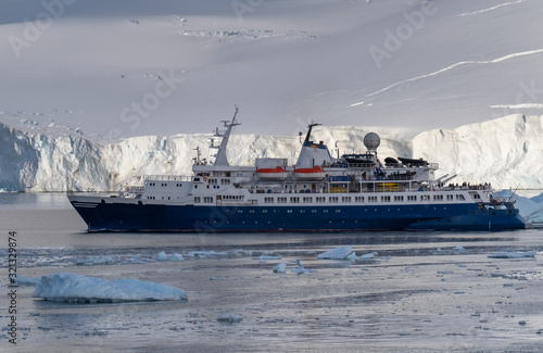 Cruise ship navigating through the stunning icy landscapes  Cuverville Island  Antarctic Peninsula  Antarctica