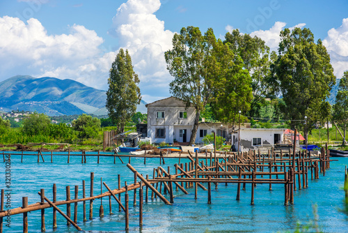 An oyster farm on Lake Butrint near Ksamil, Albania on a beautiful sunny day photo