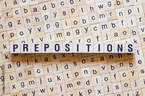 Принти на полотні Prepositions word concept on cubes