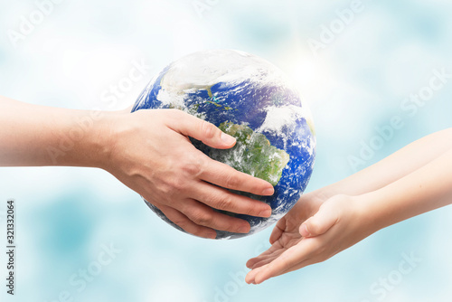 Fototapeta Naklejka Na Ścianę i Meble -  Earth globe in hands. World environment day. Elements of this image furnished by NASA.
