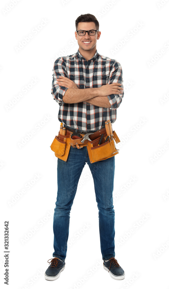 Handsome carpenter with tool belt isolated on white Handsome carpenter with tool belt isolated on white