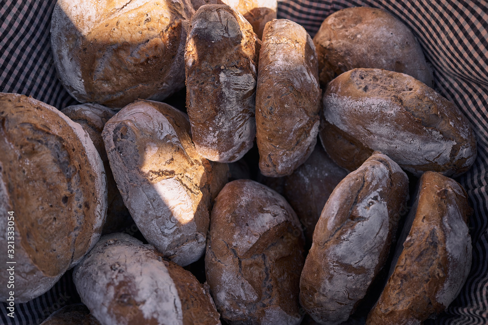 a basket of artisan breads cooked in a wood oven a basket of artisan breads cooked in a wood oven