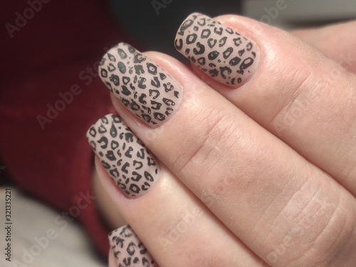 stylish manicure with a design on beautiful hands