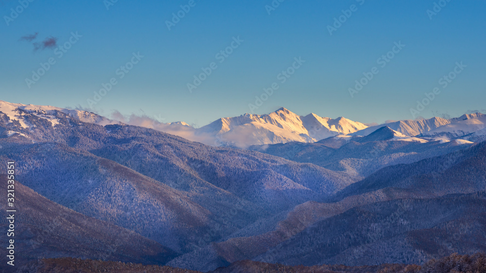 Winter sunset in caucasus mountains in Lagonaki, Adygea, Russia