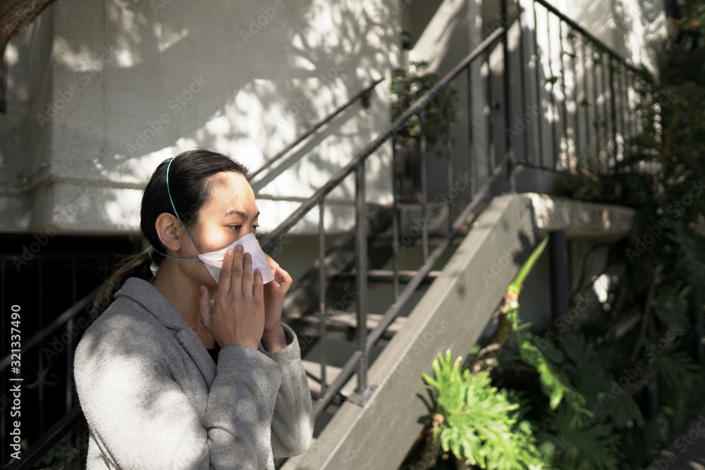 Fototapeta premium Putting on Mask