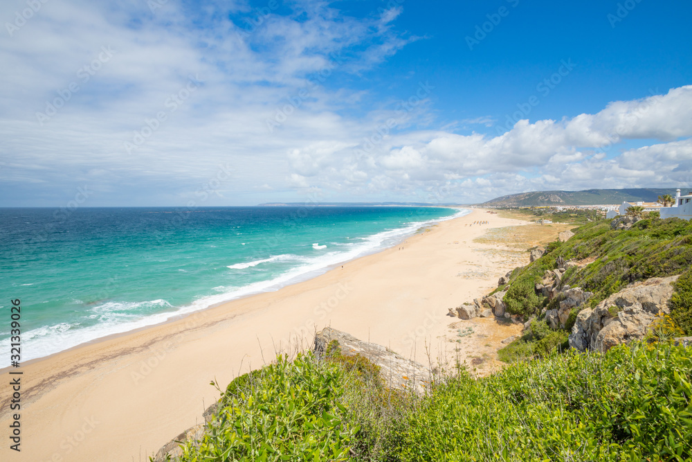 beautiful landscape of wild natural lonely beaches of Zahora and Cala Isabel, near Canos Meca village (Barbate, Cadiz, Andalusia, Spain) and Cape Trafalgar with lighthouse