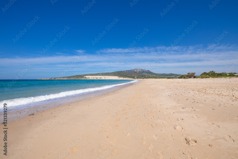 landscape of seaside in beautiful sandy big and lonely Valdevaqueros Beach, in Tarifa, Cadiz, Andalusia, Spain