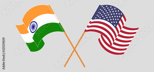 Crossed and waving flags of India and the USA
