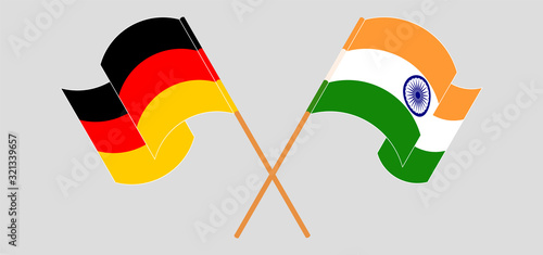 Crossed and waving flags of India and Germany