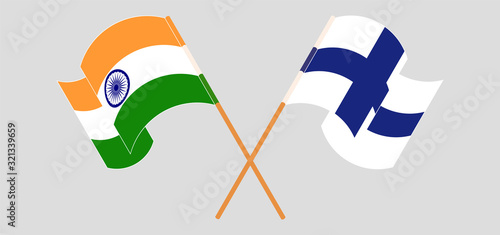 Crossed and waving flags of India and Finland