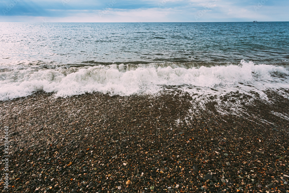 Sea Ocean Waves Washing Pebble Stones Beach At Cloudy Summer Day Sea Ocean Waves Washing Pebble Stones Beach At Cloudy Summer Day