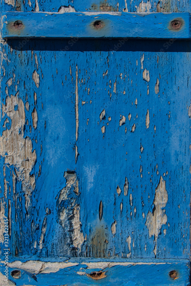 old blue paint on wooden boards, traces of time, old wood texture traces of blue paint