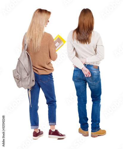 Back view of two woman in sweater.