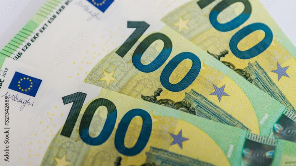 One hundred Euro bills or banknotes. Euro currency One hundred Euro bills or banknotes. Euro currency