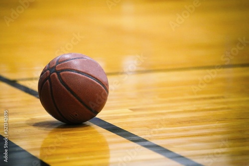 Basketball resting on court