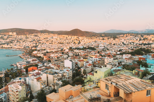 Kusadasi, Aydin Province, Turkey. Old Residential Houses And Kusadasi Cityscape In Sunny Summer Day. Kusadasi Skyline At Aegean Coast, Turkey