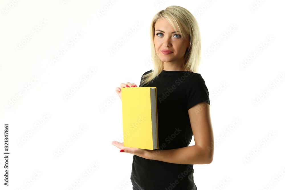 beautiful blonde woman in black t-shirt holds a yellow book on a white background beautiful blonde woman in black t-shirt holds a yellow book on a white background