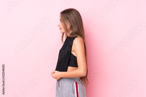 Young caucasian sporty woman holding a towel