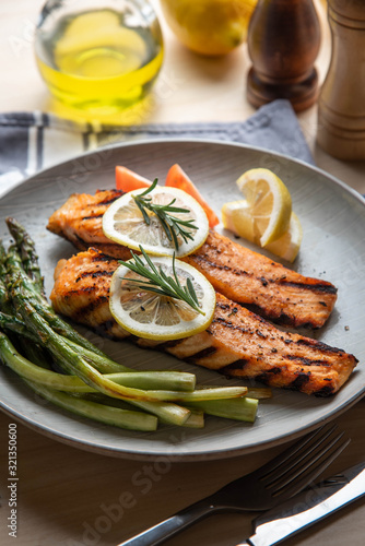 grilled salmon fillet on plate with asparagus