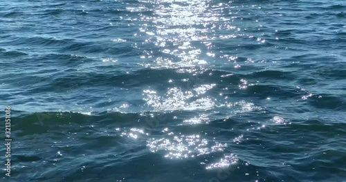 Seamless looped sparkling blue sea waves