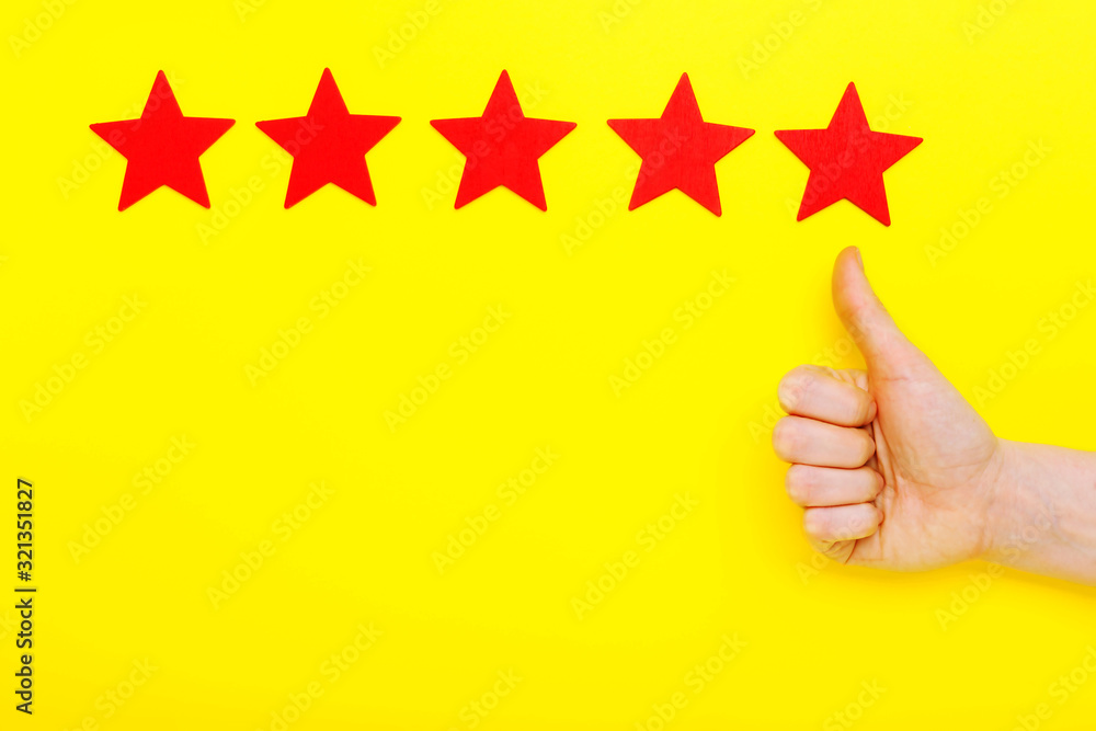 5 stars increase rating, customer experience concept. Hand of client show putting 5 star symbol to increase Service rating. five red stars excellent rating on yellow background. Satisfaction concept 5 stars increase rating, customer experience concept. Hand of client show putting 5 star symbol to increase Service rating. five red stars excellent rating on yellow background. Satisfaction concept