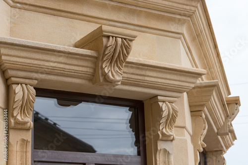 Fotografie Elements of architectural decoration of buildings. Stone cornice.