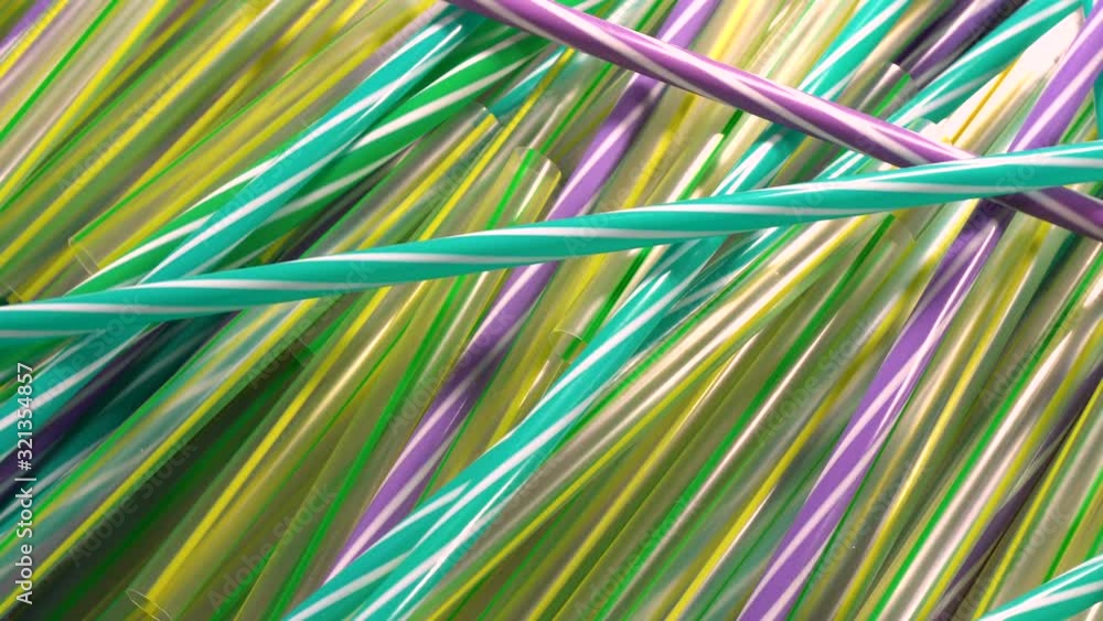 Plastic straws rotating. Straws are part of plastic pollution, damaing