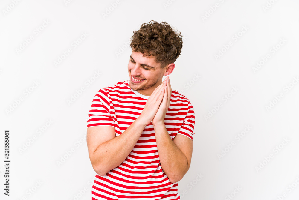 Young blond curly hair caucasian man isolated joyful laughing a lot. Happiness concept. Young blond curly hair caucasian man isolated joyful laughing a lot. Happiness concept.
