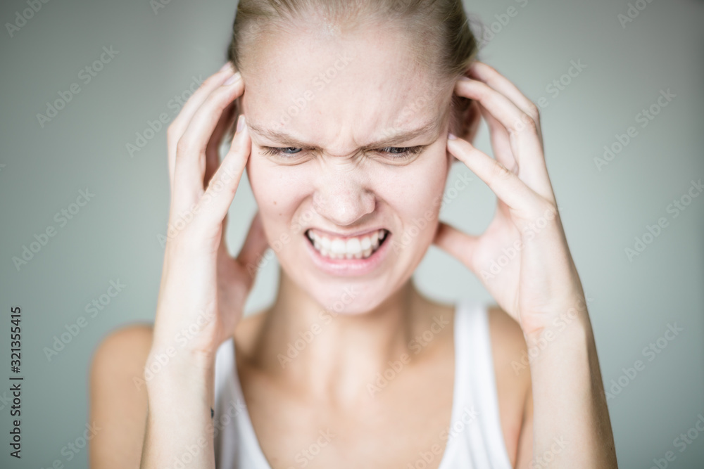 A person stressed and annoyed by loud noise. Mental disorder. A person stressed and annoyed by loud noise. Mental disorder.
