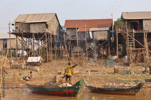 Traditional village life near the river in the countryside in Cambodia photo