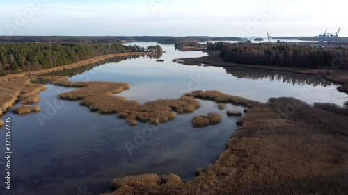 Small islands on the side of the cargo port in Helsinki Finland photo