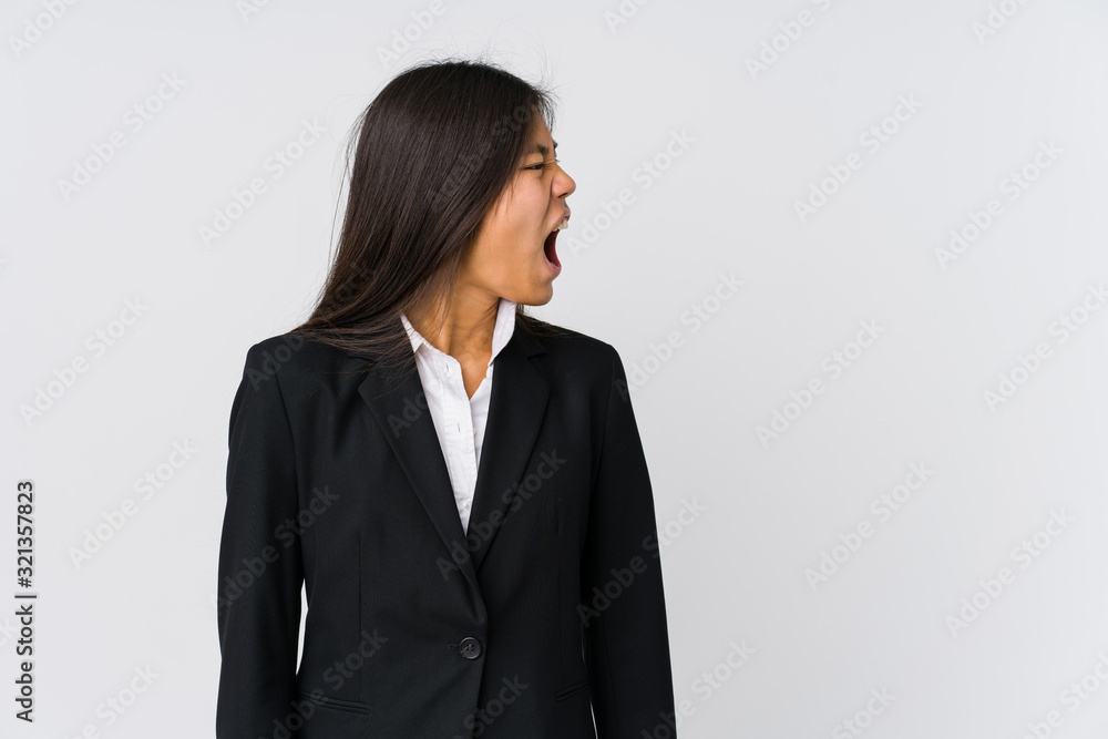 Young asian business woman shouting towards a copy space Young asian business woman shouting towards a copy space